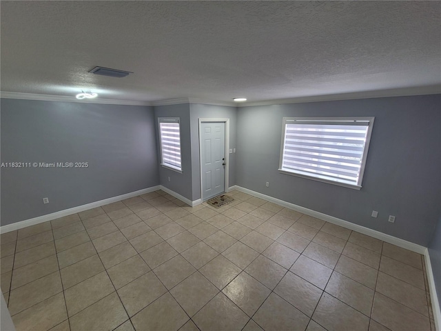 7145 NW 173rd Dr Unit 1108, Hialeah, FL 33015 - unfurnished room featuring crown molding, a textured ceiling, and light tile patterned floors