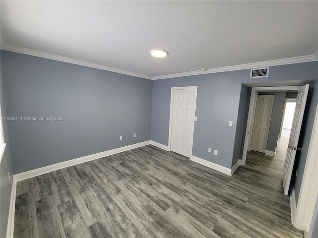 7145 NW 173rd Dr Unit 1108, Hialeah, FL 33015 - spare room featuring dark wood-type flooring, ornamental molding, and a textured ceiling