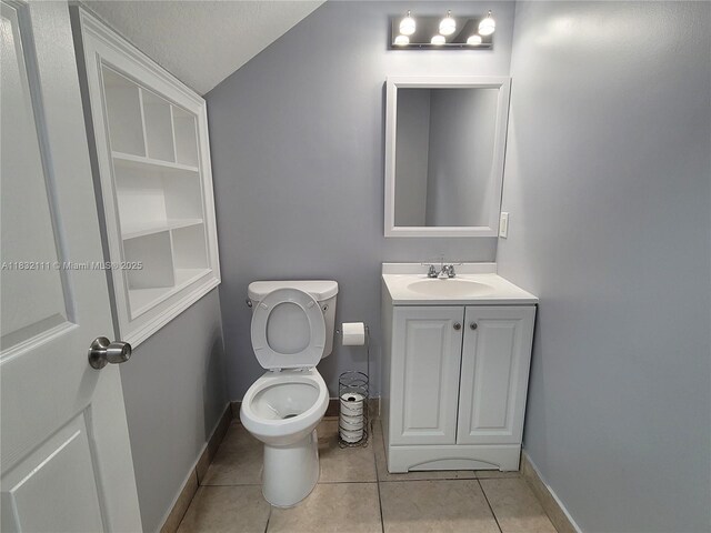 7145 NW 173rd Dr Unit 1108, Hialeah, FL 33015 - half bath with vanity, tile patterned flooring, and lofted ceiling