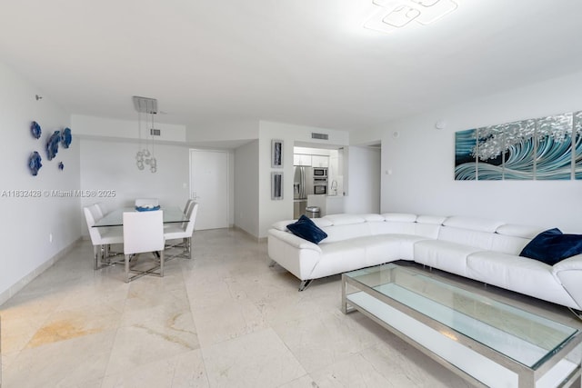 18911 Collins Ave Unit 2002, Sunny Isles Beach, FL 33160 - living area featuring baseboards