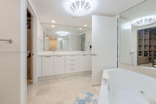 18911 Collins Ave Unit 2002, Sunny Isles Beach, FL 33160 - bathroom with double vanity, a tub with jets, recessed lighting, tile patterned floors, and a walk in closet