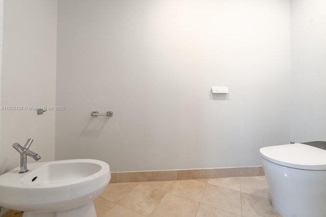 18911 Collins Ave Unit 2002, Sunny Isles Beach, FL 33160 - bathroom with a bidet and tile patterned flooring