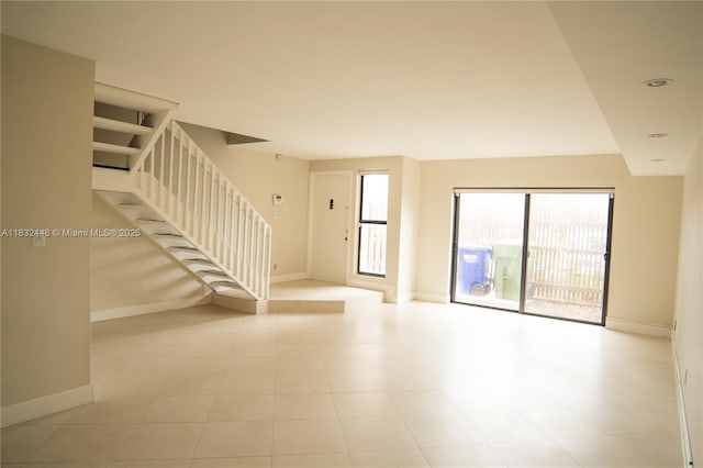 1239 NW 122nd Ter, Pembroke Pines, FL 33026 - spare room with stairway and baseboards