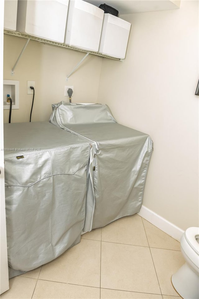 1239 NW 122nd Ter, Pembroke Pines, FL 33026 - laundry room featuring washer hookup, electric dryer hookup, and light tile patterned floors