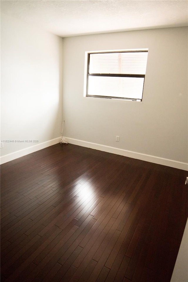 1239 NW 122nd Ter, Pembroke Pines, FL 33026 - empty room with baseboards and dark wood-style flooring