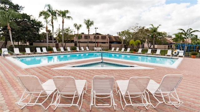 1239 NW 122nd Ter, Pembroke Pines, FL 33026 - community pool featuring a hot tub