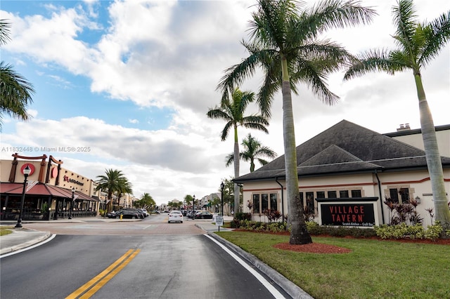 1239 NW 122nd Ter, Pembroke Pines, FL 33026 - view of asphalt road featuring curbs, street lights, and sidewalks