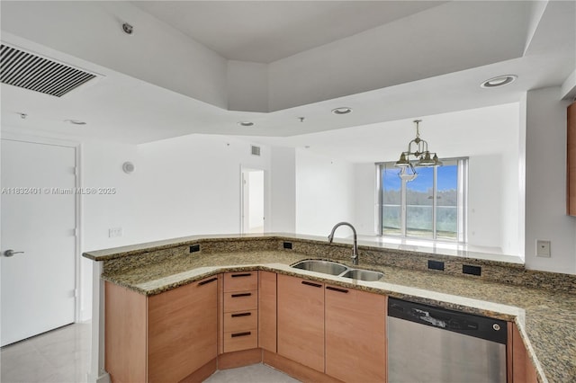 14951 Royal Oaks Ln Unit 806, North Miami, FL 33181 - kitchen with stainless steel dishwasher, dark stone counters, a chandelier, recessed lighting, and pendant lighting