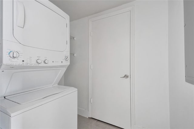 14951 Royal Oaks Ln Unit 806, North Miami, FL 33181 - laundry area featuring stacked washing machine and dryer and light tile patterned floors