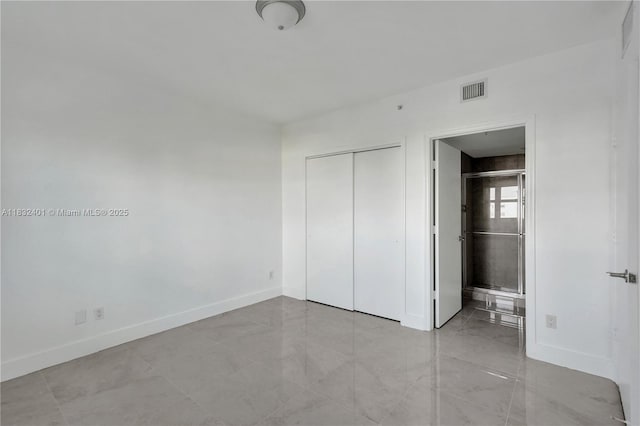 14951 Royal Oaks Ln Unit 806, North Miami, FL 33181 - unfurnished bedroom with baseboards and a closet