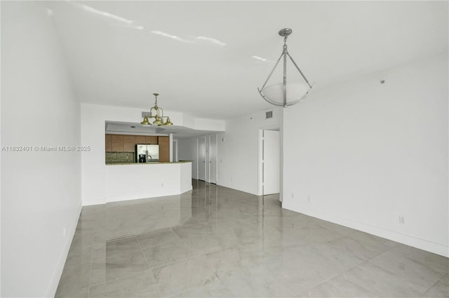 14951 Royal Oaks Ln Unit 806, North Miami, FL 33181 - unfurnished living room featuring a chandelier and light marble finish floors