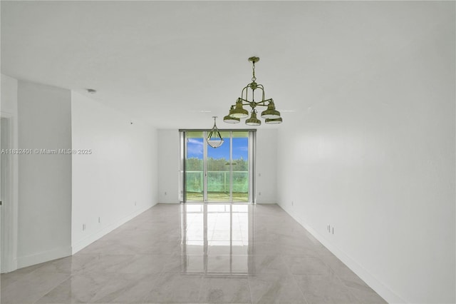14951 Royal Oaks Ln Unit 806, North Miami, FL 33181 - empty room with a chandelier, floor to ceiling windows, and a smoke detector