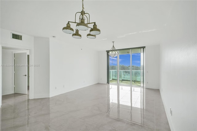 14951 Royal Oaks Ln Unit 806, North Miami, FL 33181 - empty room featuring a chandelier and expansive windows