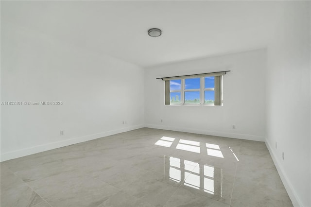 14951 Royal Oaks Ln Unit 806, North Miami, FL 33181 - spare room featuring baseboards