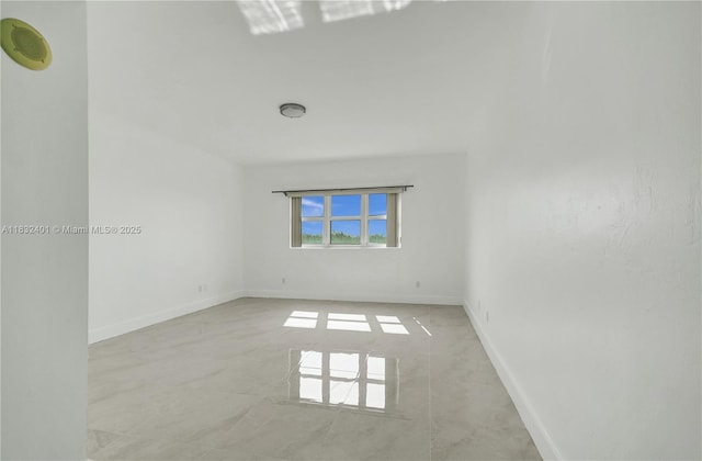 14951 Royal Oaks Ln Unit 806, North Miami, FL 33181 - spare room featuring baseboards