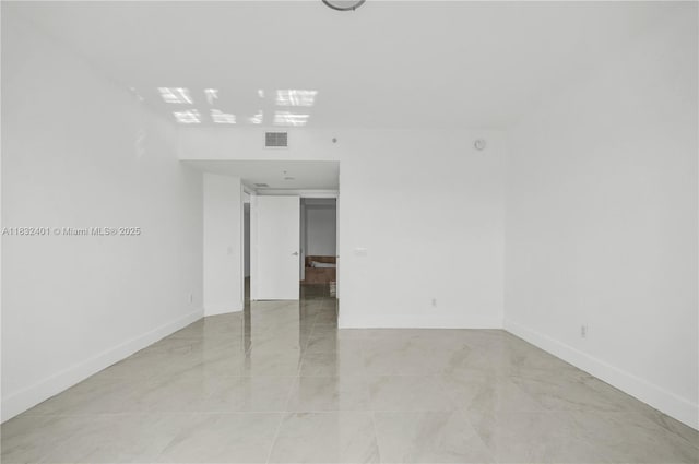14951 Royal Oaks Ln Unit 806, North Miami, FL 33181 - spare room with baseboards