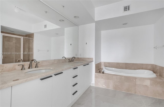 14951 Royal Oaks Ln Unit 806, North Miami, FL 33181 - full bathroom featuring a garden tub, double vanity, a stall shower, and tile patterned flooring