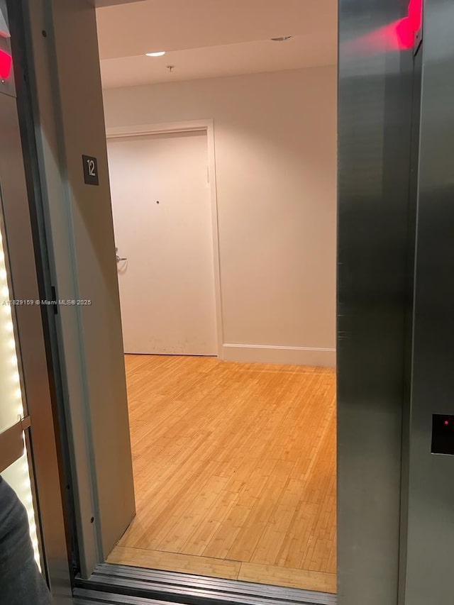 18201 Collins Ave Unit 1202, Sunny Isles Beach, FL 33160 - corridor with wood finished floors and elevator