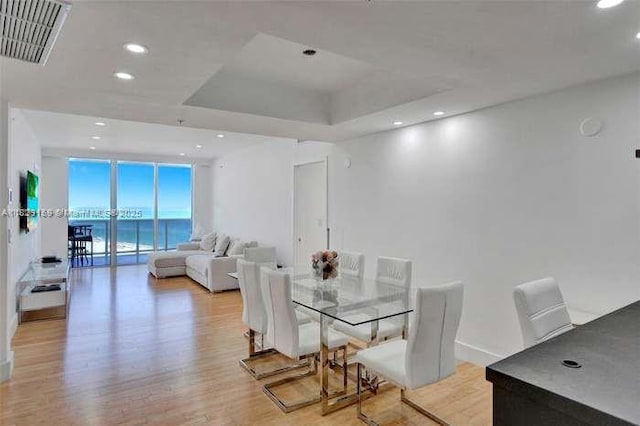 18201 Collins Ave Unit 1202, Sunny Isles Beach, FL 33160 - dining room featuring light wood finished floors, recessed lighting, and a raised ceiling