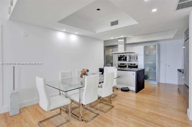 18201 Collins Ave Unit 1202, Sunny Isles Beach, FL 33160 - dining room with a raised ceiling, light wood-style flooring, and recessed lighting