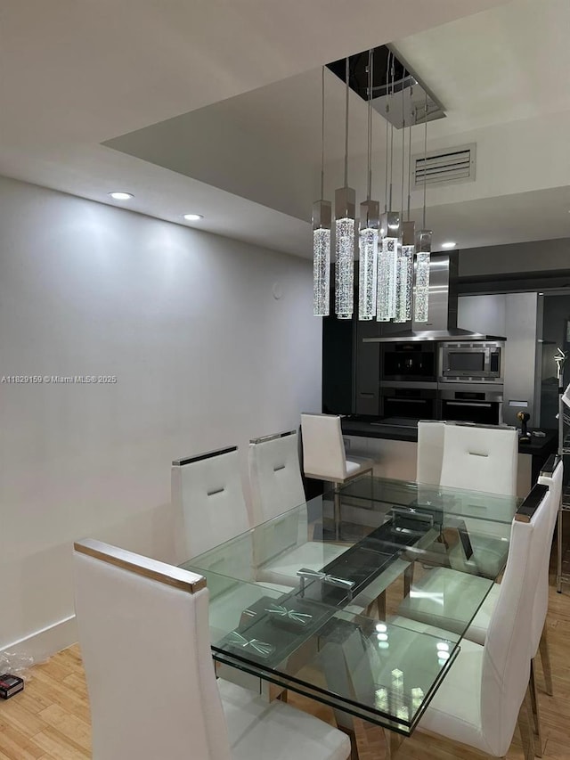 18201 Collins Ave Unit 1202, Sunny Isles Beach, FL 33160 - dining area with recessed lighting and wood finished floors