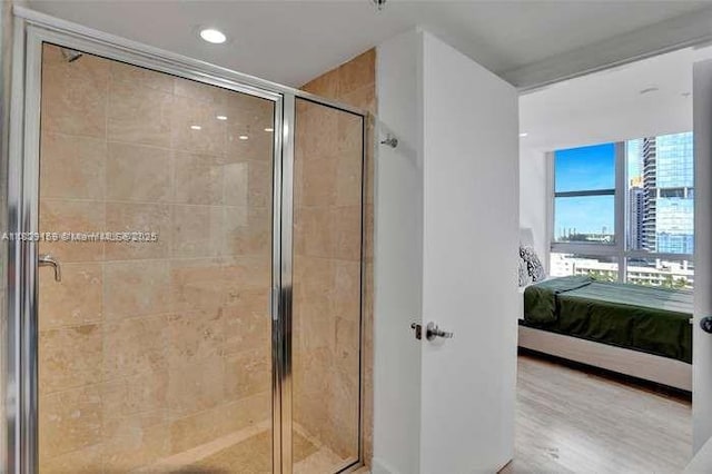 18201 Collins Ave Unit 1202, Sunny Isles Beach, FL 33160 - full bathroom with connected bathroom, a shower stall, wood finished floors, and recessed lighting