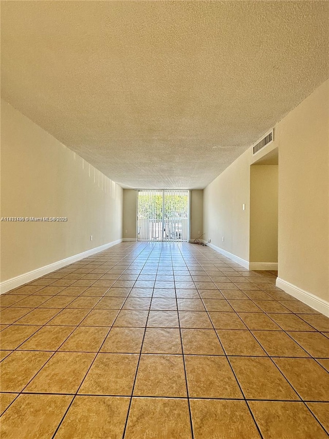 1800 Sans Souci Blvd Unit 105, North Miami, FL 33181 - unfurnished room with a textured ceiling
