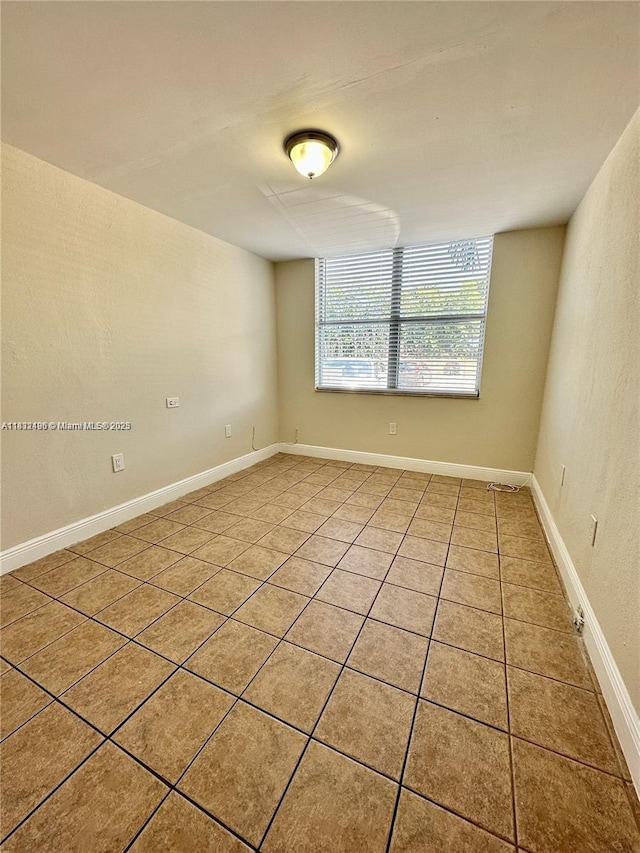 1800 Sans Souci Blvd Unit 105, North Miami, FL 33181 - empty room with light tile patterned floors