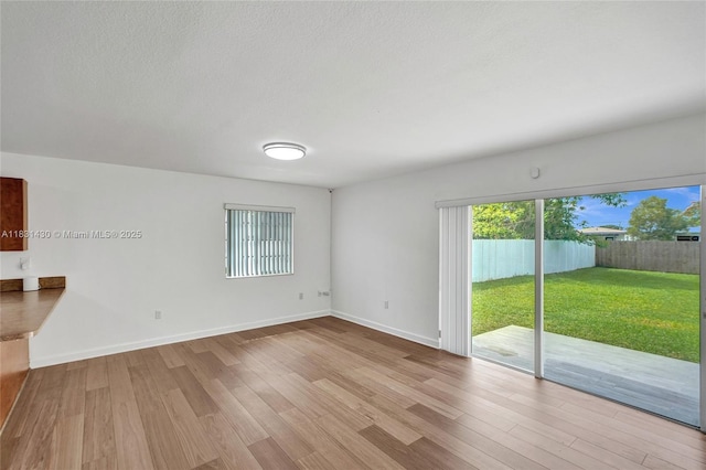 12254 SW 217th St, Miami, FL 33170 - unfurnished living room with wood finished floors and baseboards