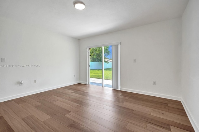 12254 SW 217th St, Miami, FL 33170 - empty room featuring wood finished floors and baseboards