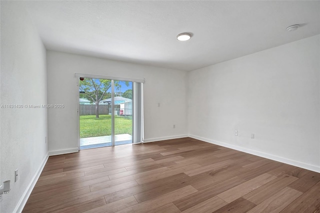 12254 SW 217th St, Miami, FL 33170 - unfurnished room featuring wood finished floors and baseboards