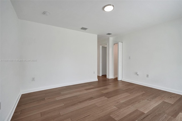 12254 SW 217th St, Miami, FL 33170 - unfurnished room with a smoke detector and wood finished floors