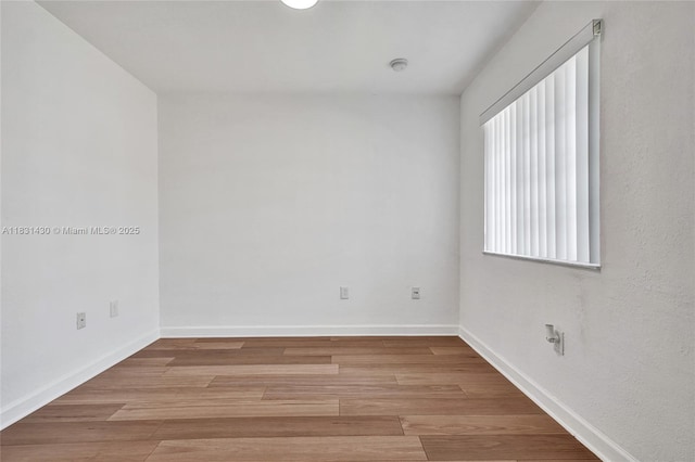 12254 SW 217th St, Miami, FL 33170 - unfurnished room featuring wood finished floors and a smoke detector