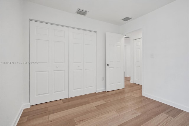 12254 SW 217th St, Miami, FL 33170 - unfurnished bedroom with light wood-style floors and a closet