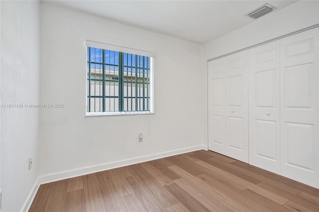 12254 SW 217th St, Miami, FL 33170 - unfurnished bedroom with wood finished floors and a closet