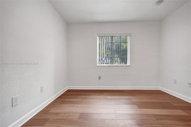 12254 SW 217th St, Miami, FL 33170 - unfurnished room featuring wood finished floors and a smoke detector