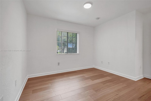 12254 SW 217th St, Miami, FL 33170 - spare room with light wood-style flooring and baseboards