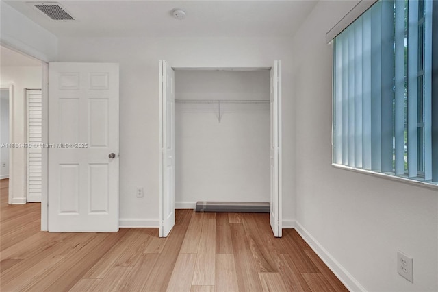 12254 SW 217th St, Miami, FL 33170 - unfurnished bedroom featuring light wood-type flooring and a closet