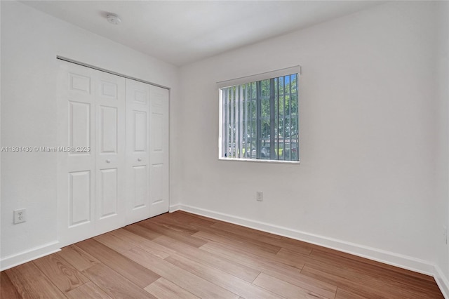 12254 SW 217th St, Miami, FL 33170 - unfurnished bedroom with light wood-style flooring and a closet