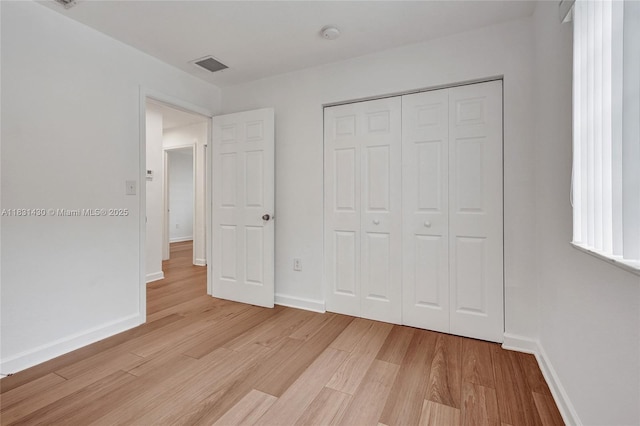 12254 SW 217th St, Miami, FL 33170 - unfurnished bedroom with light wood-style floors and a closet