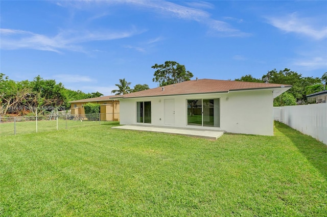 12254 SW 217th St, Miami, FL 33170 - rear view of property featuring stucco siding, a fenced backyard, and a patio area