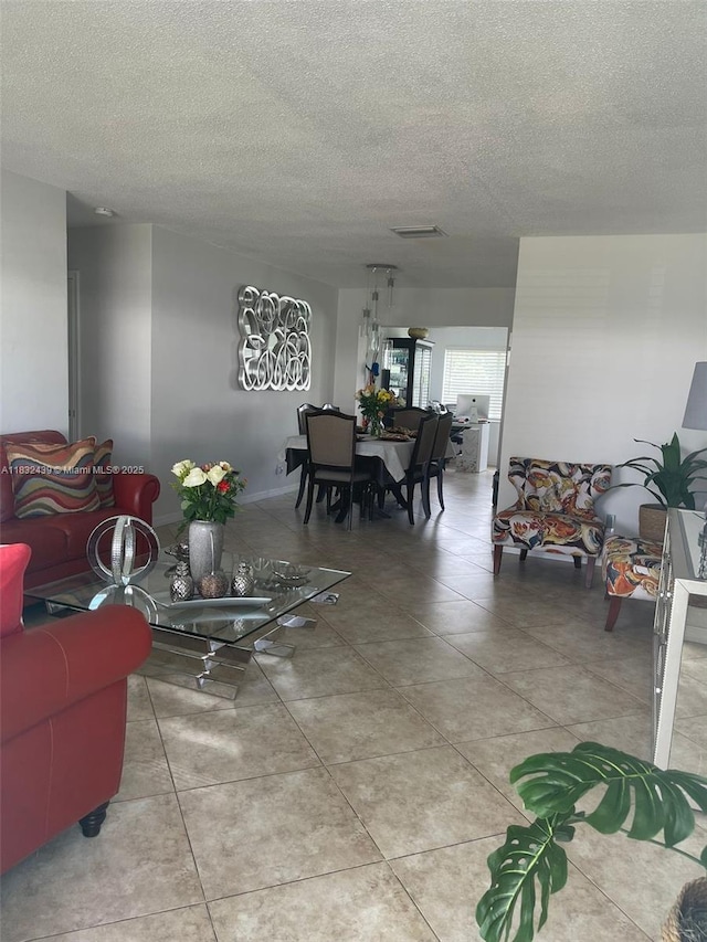 8312 NW 59th St, Tamarac, FL 33321 - living area with light tile patterned floors and a textured ceiling