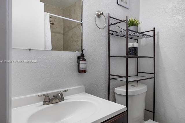 505 SE 20th St, Fort Lauderdale, FL 33316 - full bathroom with a textured wall, vanity, and a shower