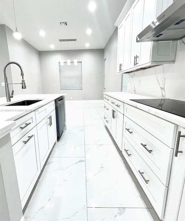 1013 SW Deauville Ave, Port St Lucie, FL 34953 - kitchen with under cabinet range hood, light marble finish floors, dishwasher, recessed lighting, and black electric stovetop