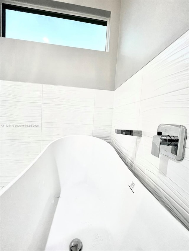 1013 SW Deauville Ave, Port St Lucie, FL 34953 - bathroom view of a freestanding bath