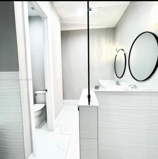 1013 SW Deauville Ave, Port St Lucie, FL 34953 - bathroom with marble look tiles and double vanity