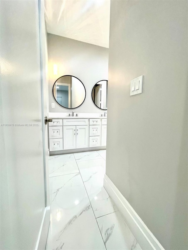 1013 SW Deauville Ave, Port St Lucie, FL 34953 - bathroom featuring marble look tiles and vanity