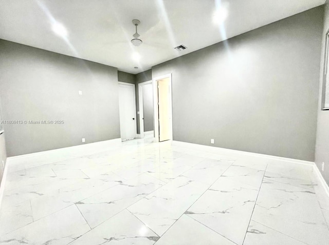 1013 SW Deauville Ave, Port St Lucie, FL 34953 - unfurnished room featuring light marble finish flooring and baseboards