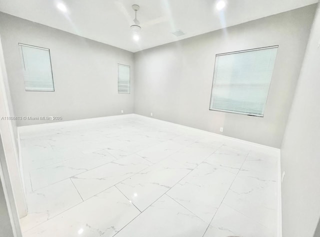 1013 SW Deauville Ave, Port St Lucie, FL 34953 - spare room with marble finish floors and baseboards