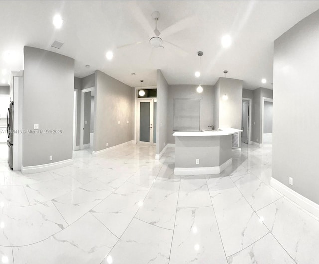 1013 SW Deauville Ave, Port St Lucie, FL 34953 - unfurnished room featuring light marble finish floors, ceiling fan, and recessed lighting